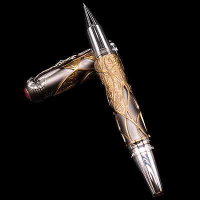 Montblanc Writer's Edition Brothers Grimm Limited Edition 1812 Rollerball Pen - Preowned laying on top of its cap in a crossed position showing full view of the entire uncapped pen.