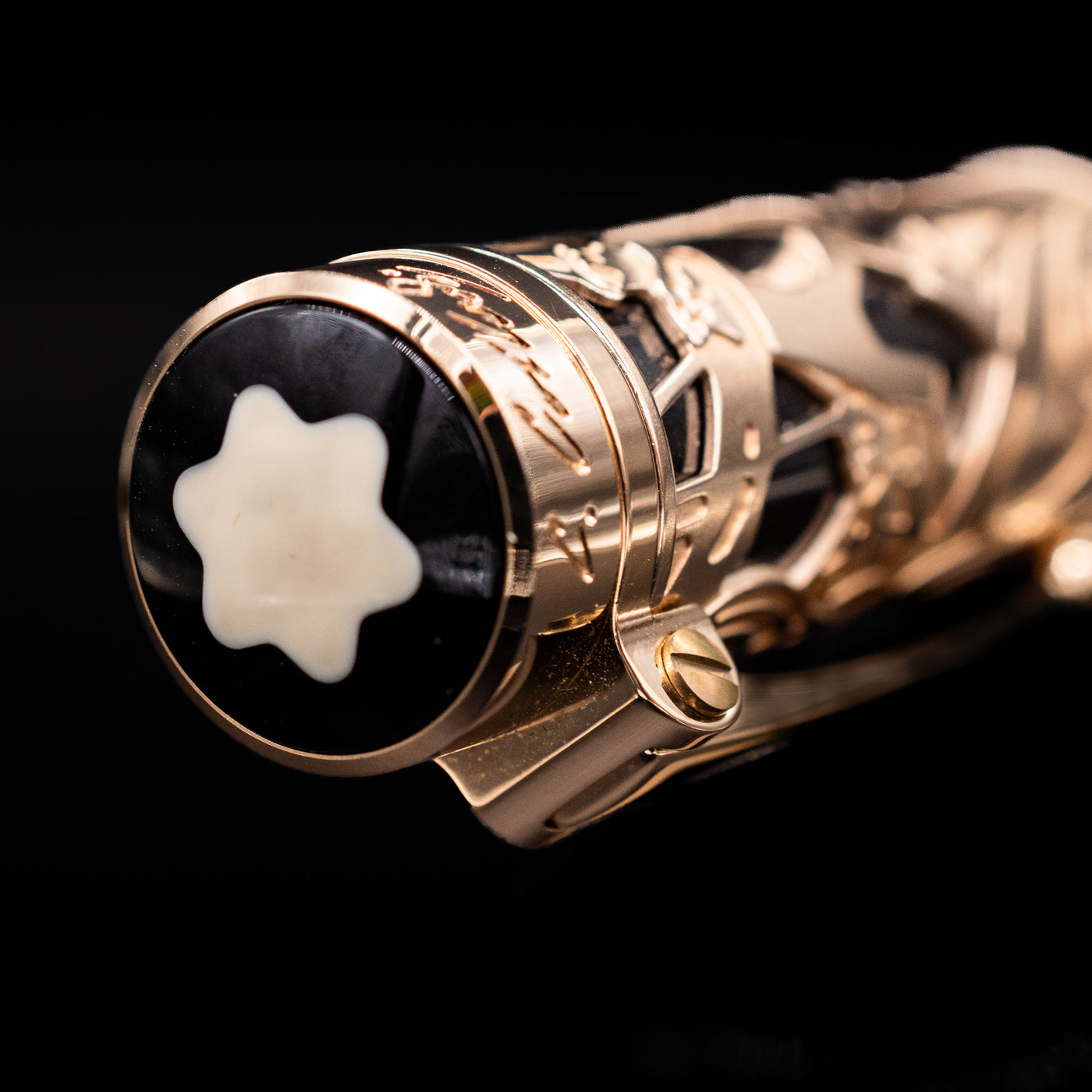 A zoomed-in view of the top of the cap with the finial for the Montblanc Writer's Edition Carlo Collodi Ballpoint Pen - Preowned.