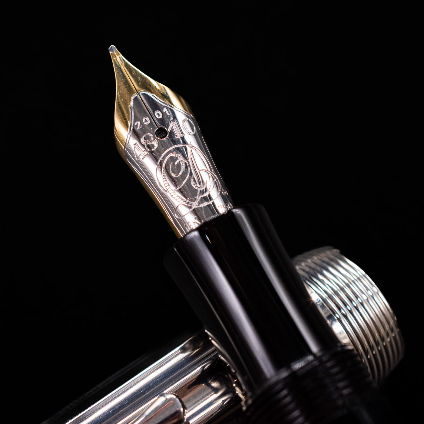 A macro shot of the nib with its intricate detailing and logo engraving for the Montblanc Writer's Edition Charles Dickens Fountain Pen - Preowned.