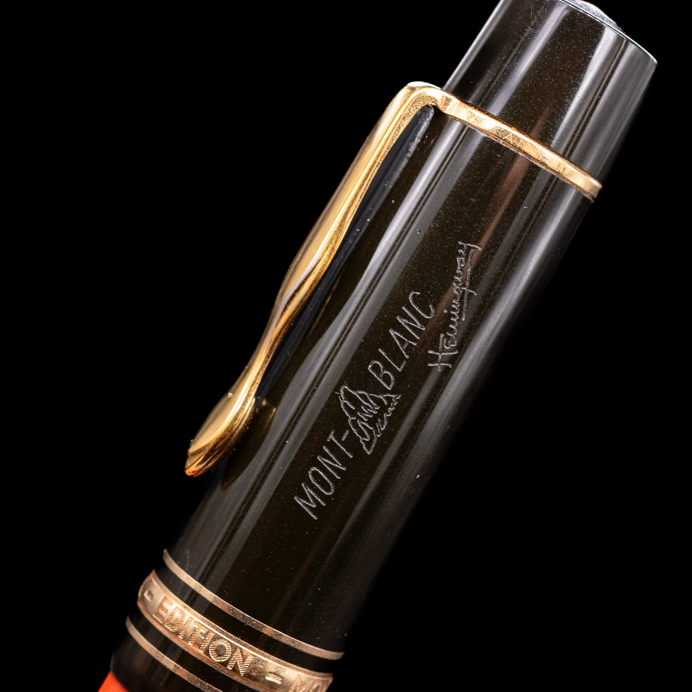 Zoomed-in view of the logo and writer's siganture on the cap of the Montblanc Writer's Edition Ernest Hemingway Fountain Pen - Preowned.