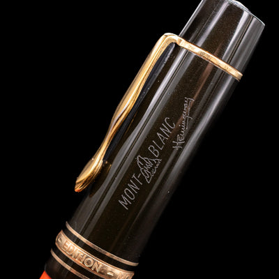 Zoomed-in view of the logo and writer's siganture on the cap of the Montblanc Writer's Edition Ernest Hemingway Fountain Pen - Preowned.