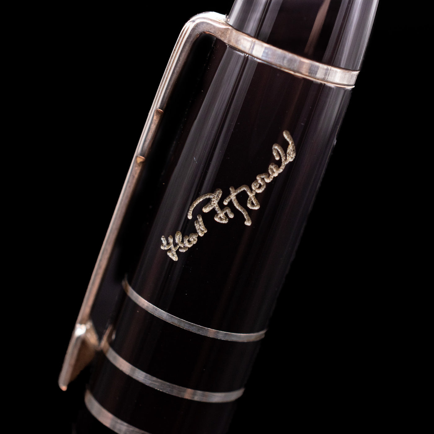 A macro shot of the writer's signature on top of the barrel of the Montblanc Writer's Edition F Scott Fitzgerald Ballpoint Pen - Preowned.