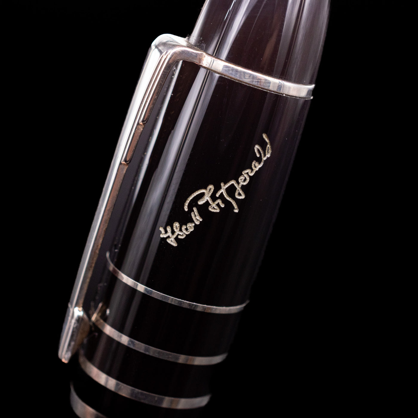 A close-up view of the writer's signature on the cap of the Montblanc Writer's Edition F. Scott Fitzgerald Fountain Pen - Preowned.