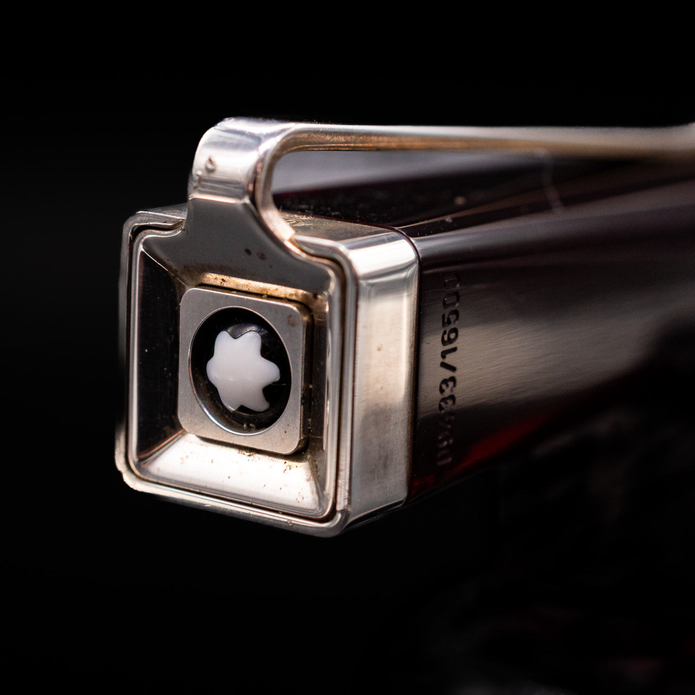 A macro shot of the top of the cap with the Montblanc logo on the Montblanc Writer's Edition Franz Kafka Ballpoint Pen - Preowned.