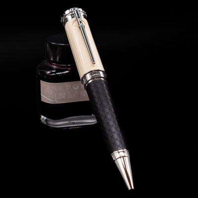 Montblanc Writer's Edition Homage to Robert Louis Stevenson Ballpoint Pen - Preowned leaning against an ink bottle.