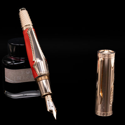 Montblanc Writer's Edition Homer 1581 Fountain Pen - Preowned leaning on an ink bottle uncapped showcasing the detailing on the nib.