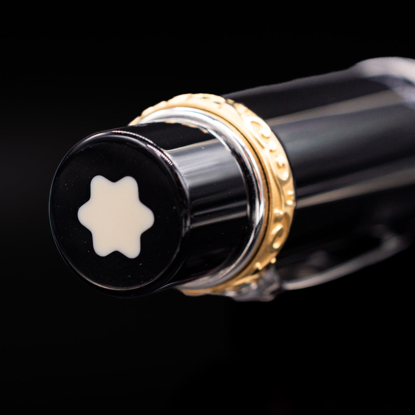 A zoomed-in view of the top of the cap with the finial on the Montblanc Writer's Edition Honore de Balzac Ballpoint Pen - Preowned.