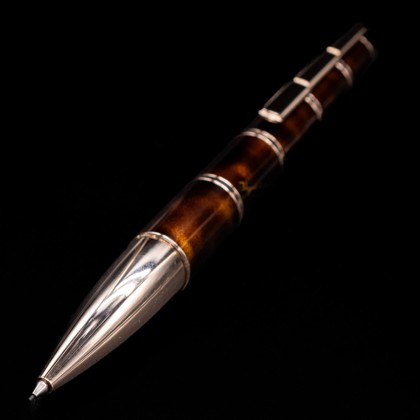 A full view of the Montblanc Writer's Edition Miguel de Cervantes Mechanical Pencil - Preowned with a focus on the tip.