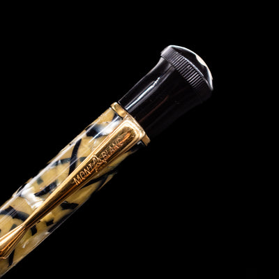 A close-up shot of the logo on the clip of the Montblanc Writer's Edition Oscar Wilde Ballpoint Pen - Preowned.