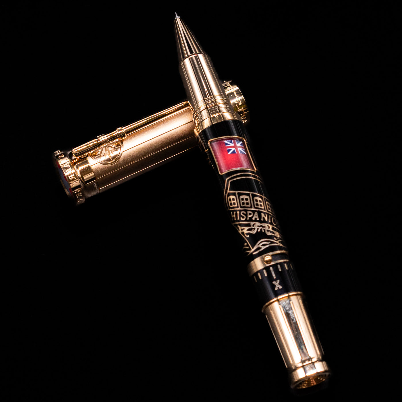 Montblanc Writer's Edition Robert Louis Stevenson Limited Edition 1833 Rollerball Pen - Preowned laying on top of its cap in a crossed position showing full view of the entire uncapped pen.