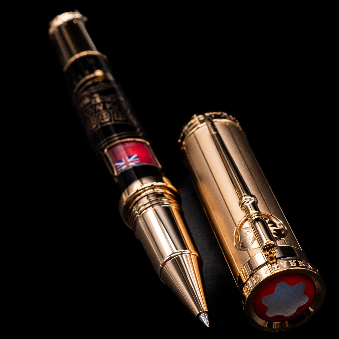 A full view of the Montblanc Writer's Edition Robert Louis Stevenson Limited Edition 1833 Rollerball Pen - Preowned uncapped, with its cap laying next to the pen. 