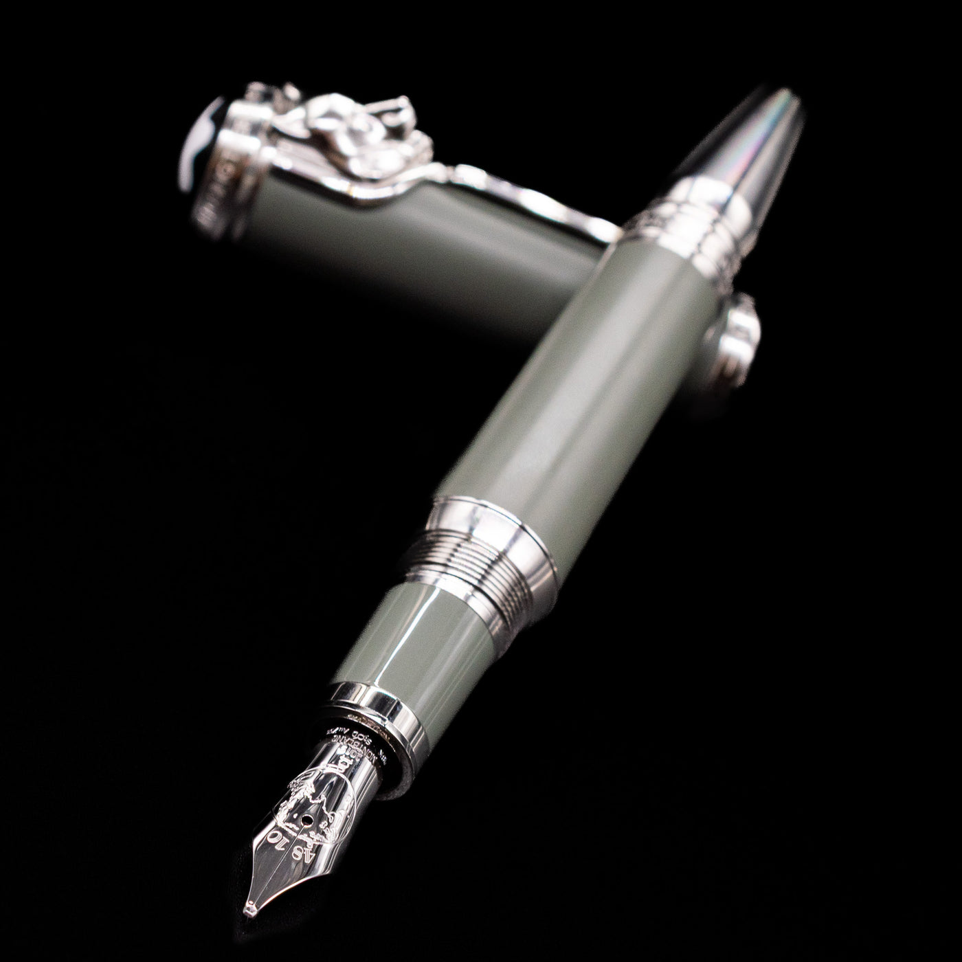 Montblanc Writer's Edition Rudyard Kipling Fountain Pen - Preowned laying across its own cap, crossed, with a focus on the nib.