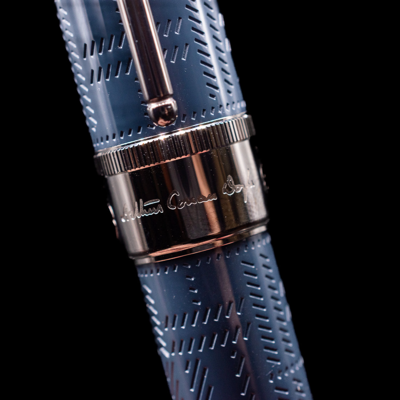 A macro shot of the center band where the writer's signature os found on the Montblanc Writer's Edition Sir Arthur Conan Doyle Ballpoint Pen - Preowned.