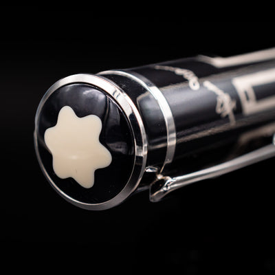 A zoomed-in view of the top of the cap with the snowcap on the Montblanc Writer's Edition Thomas Man Ballpoint Pen - Preowned.