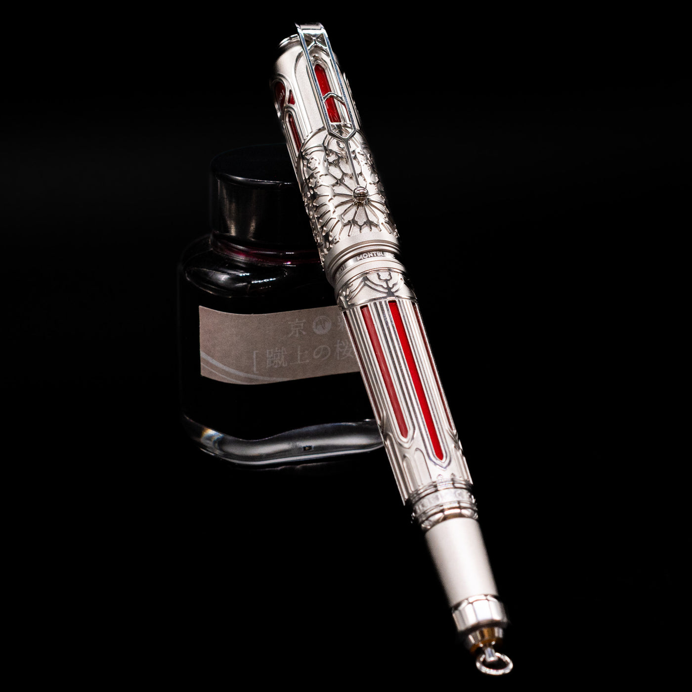 Montblanc Writer's Edition Victor Hugo Limited Edition 1831 Rollerball Pen - Preowned capped, leaning against an ink bottle. 