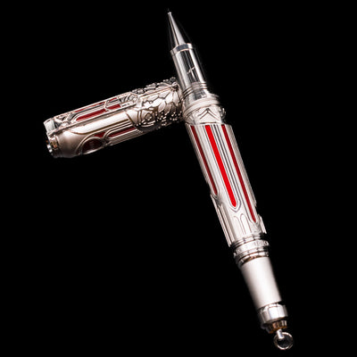 Montblanc Writer's Edition Victor Hugo Limited Edition 1831 Rollerball Pen - Preowned laying on top of its cap in a crossed position showing full view of the entire uncapped pen.