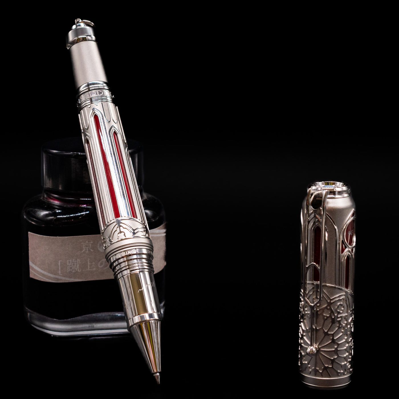 Montblanc Writer's Edition Victor Hugo Limited Edition 1831 Rollerball Pen - Preowned leaning on an ink bottle uncapped.