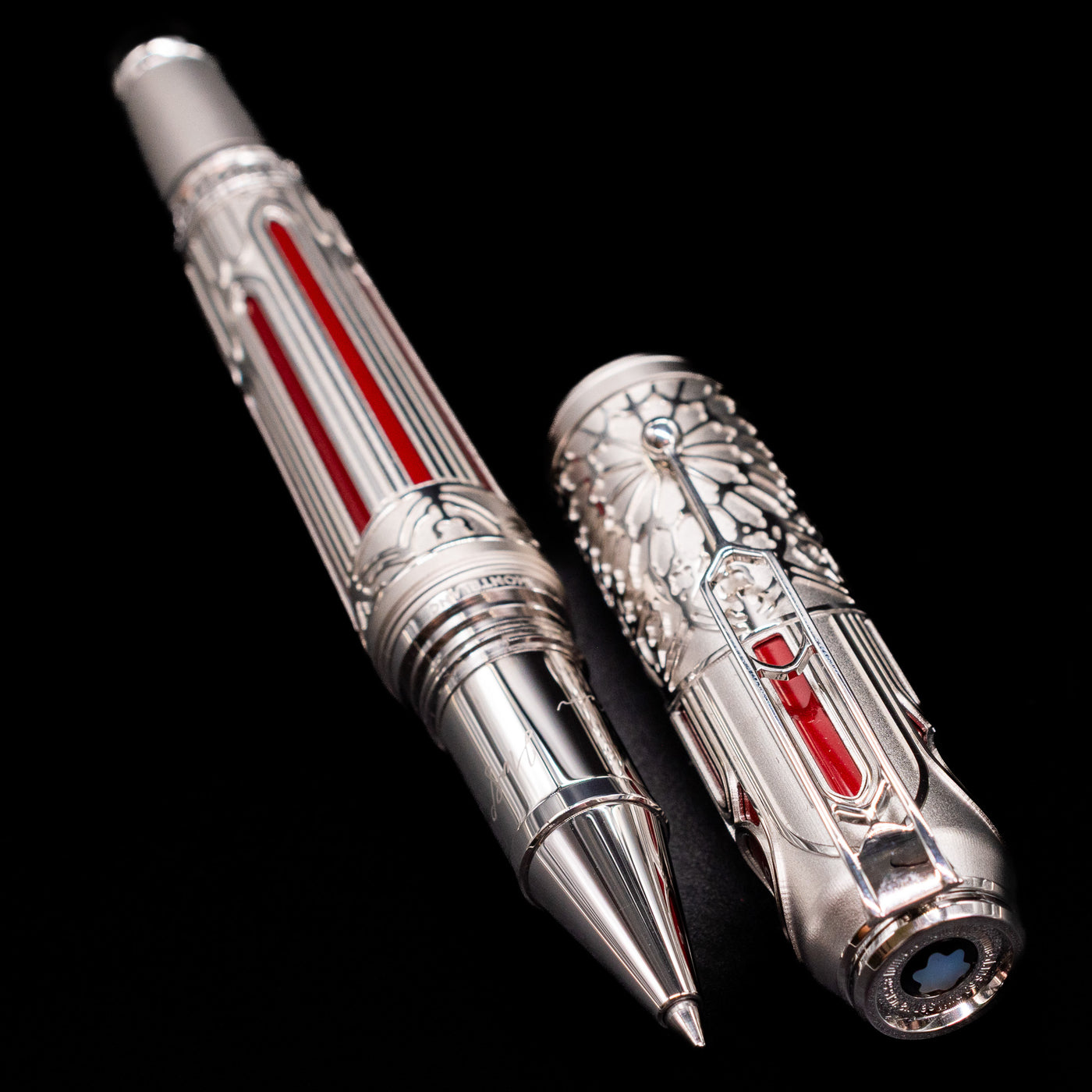 A full view of the Montblanc Writer's Edition Victor Hugo Limited Edition 1831 Rollerball Pen - Preowned uncapped, with its cap laying next to the pen.