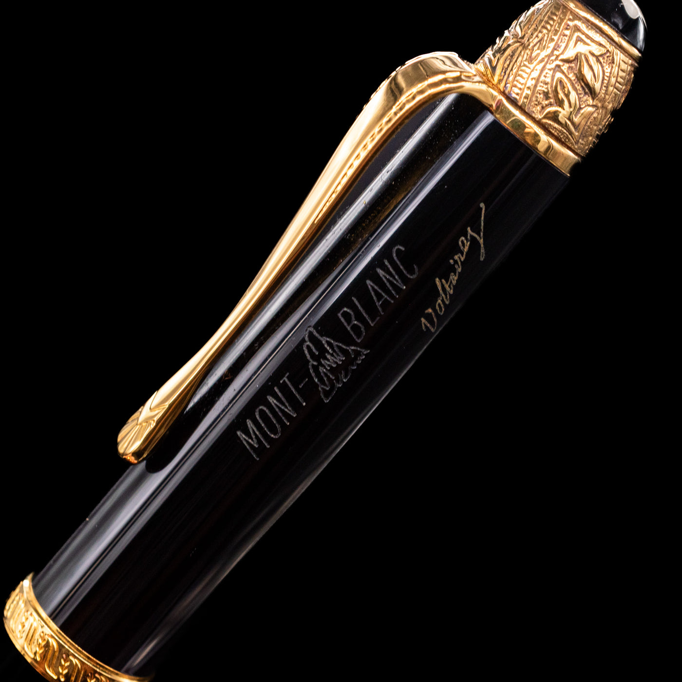 A closed-up shot of the logo and the writer's signature of the Montblanc Writer's Edition Voltaire Ballpoint Pen - Preowned.