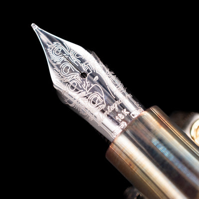  A macro shot of the nib with its intricate detailing and logo engraving for the Montegrappa Alchemist Ignis Fountain Pen.