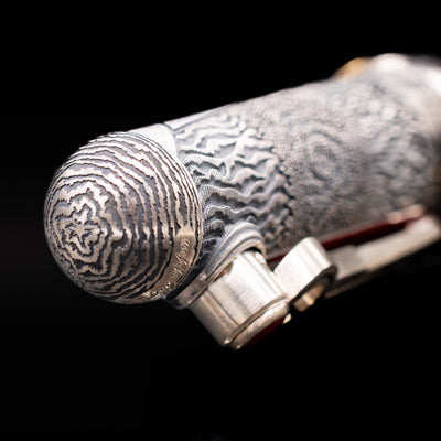 Zoomed-in view of the top of the cap with the finial on the Montegrappa Alchemist Ignis Rollerbal Pen.