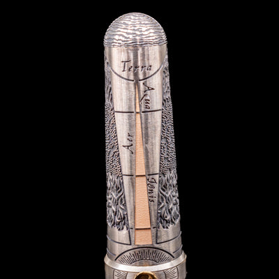 A detail shot of the back of the cap showcasing the 4 elements on the Montegrappa Alchemist Terra Rollerball Pen.