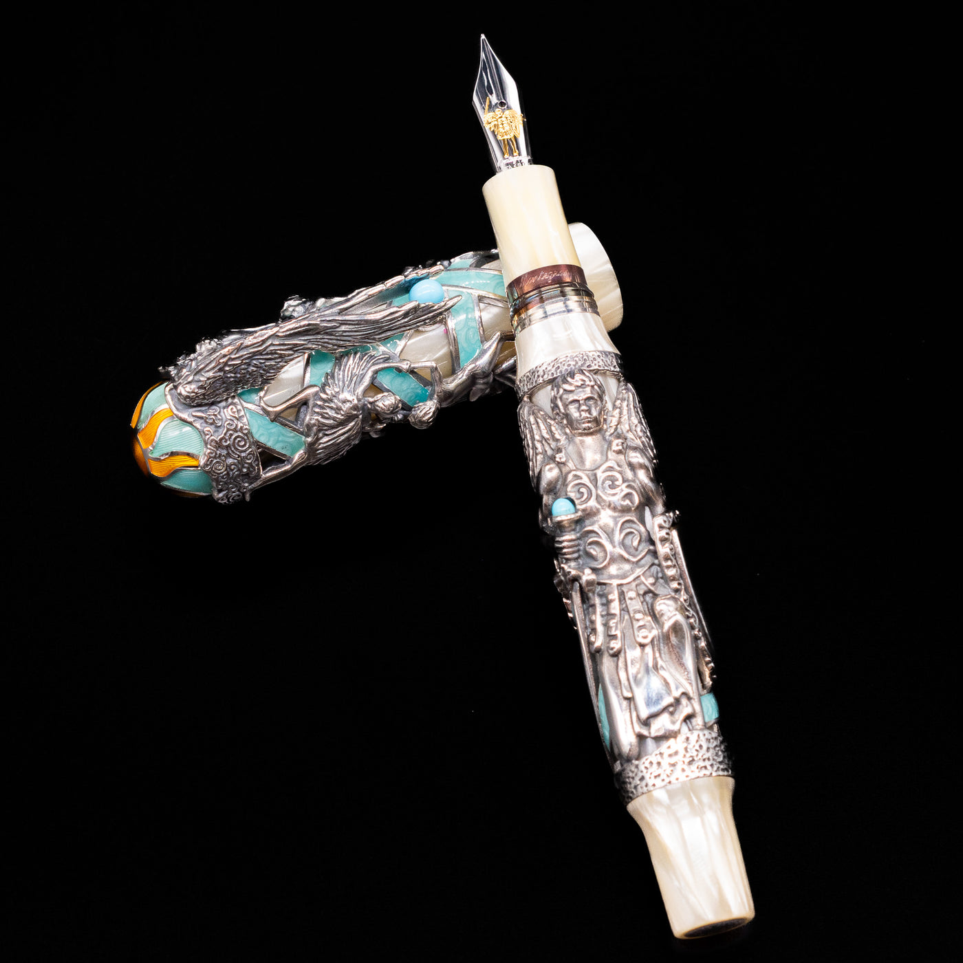 Montegrappa My Guardian Angel Fountain Pen laying on top of its cap in a crossed position showing full view of the entire uncapped pen.