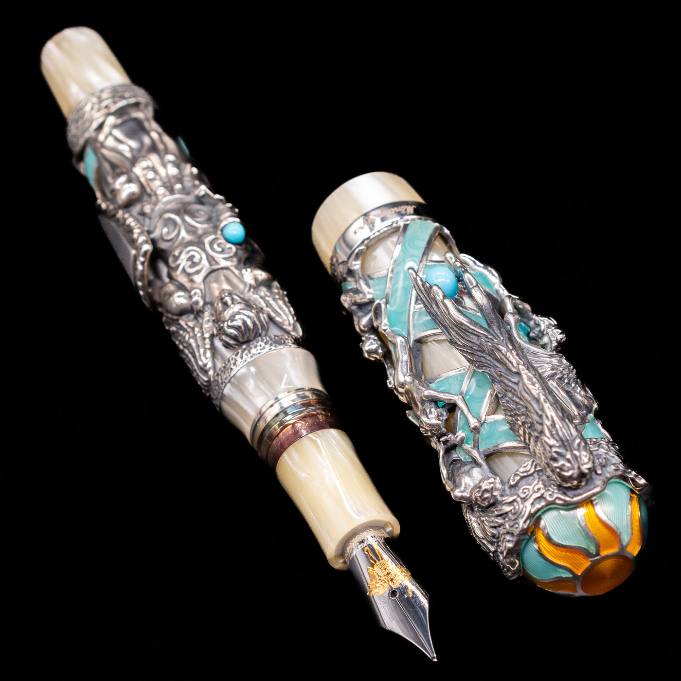 A full view of the Montegrappa My Guardian Angel Fountain Pen uncapped, with its cap laying next to the pen. 