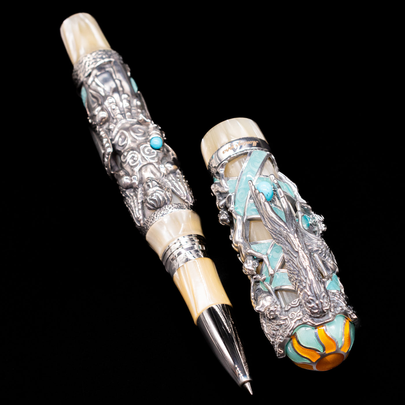  A full view of the Montegrappa My Guardian Angel Rollerbal Pen uncapped, with its cap laying next to the pen. 