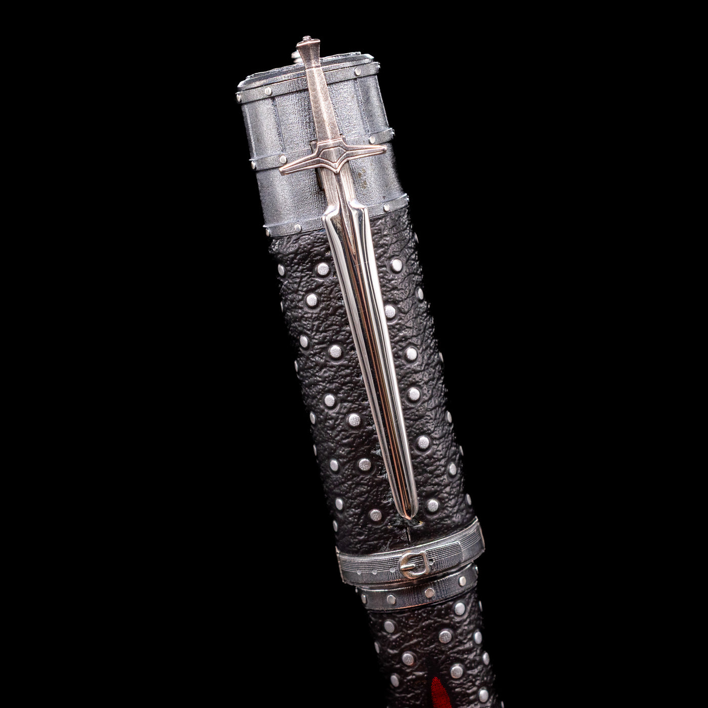Close-up view of the cap and sword-like clip on the Montegrappa The Witcher: Mutation Rollerbal Pen.