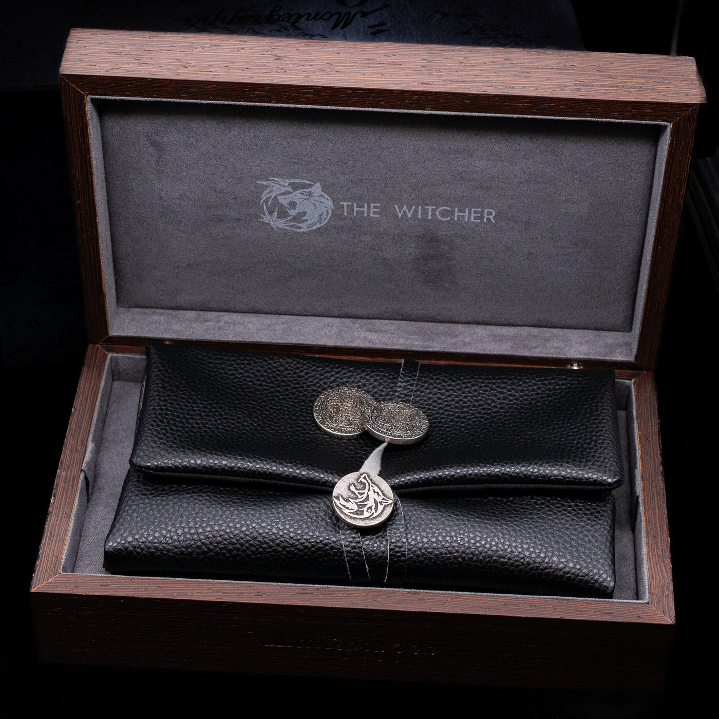 The inner lacquered box opened to showcase the pen leather case and 2 coins on the Montegrappa The Witcher: Mutation Fountain Pen.