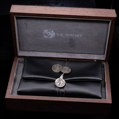 The inner lacquered box opened to showcase the pen leather case and 2 coins on the Montegrappa The Witcher: Mutation Fountain Pen.