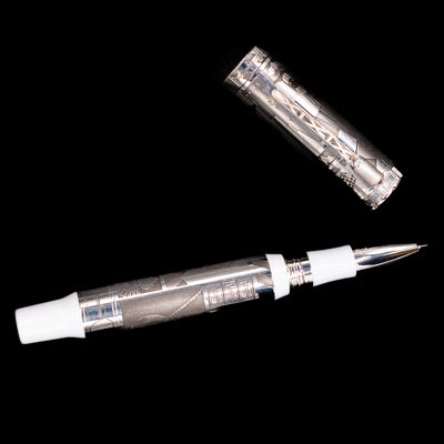 An overhead view of the Montegrappa Warner Brothers 100th Anniversary Rollerball Pen uncapped.