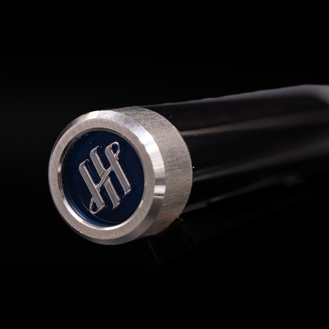 Zoomed-in view of the top of the cap with the finial on the Montegrappa Zero Black & Palladium Fountain Pen - Preowned.