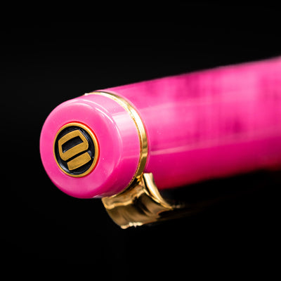 Zoomed-in view of the top of the cap with the finial on the Nagasawa Original Fountain Pen - Suma-Rikyu Rose.