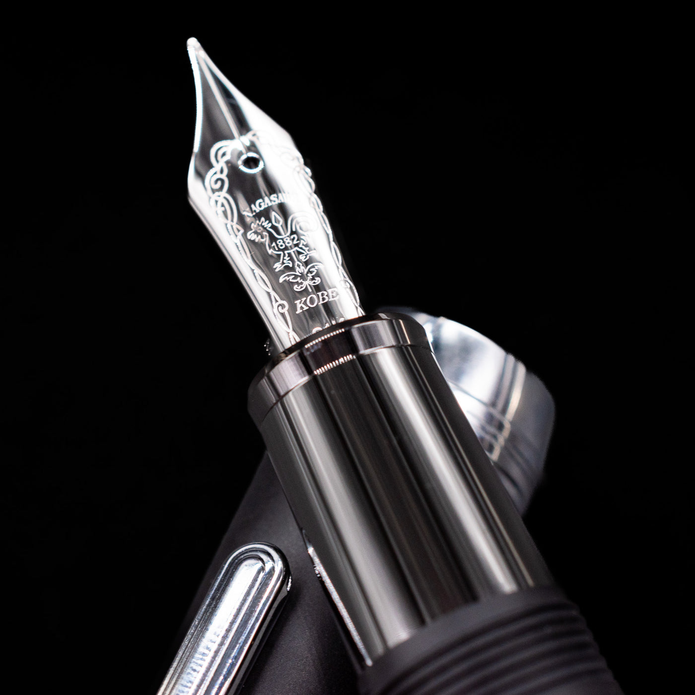 A macro shot of the nib with its intricate detailing and logo engraving for the Nagasawa Original Large Fountain Pen Black - Silver FL (For Lawyer) nib close-up.