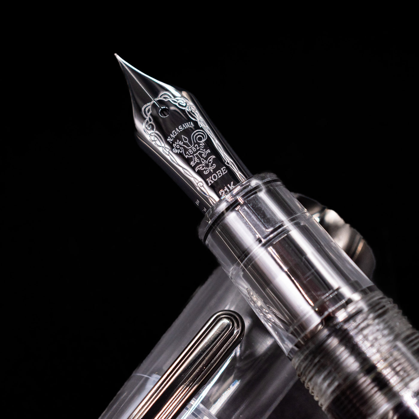 A macro shot of the nib with its intricate detailing and logo engraving for the Nagasawa Original Professional Gear Fountain Pen - Skeleton Black.