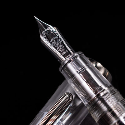 A macro shot of the nib with its intricate detailing and logo engraving for the Nagasawa Original Professional Gear Fountain Pen - Skeleton Black.