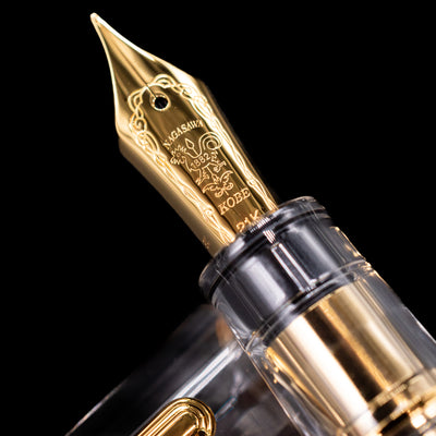 A macro shot of the nib with its intricate detailing and logo engraving for the Nagasawa Original Professional Gear Fountain Pen - Skeleton Gold.