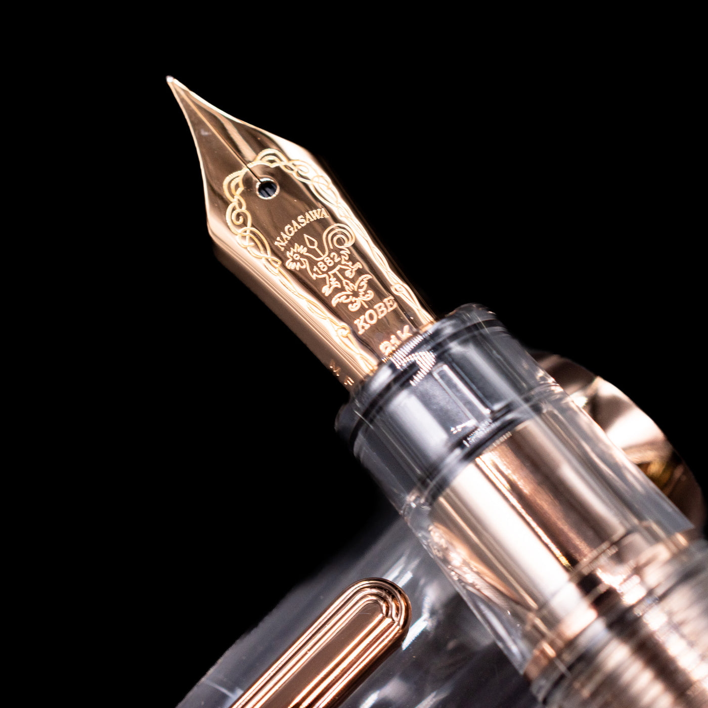 A macro shot of the nib with its intricate detailing and logo engraving for the Nagasawa Original Professional Gear Fountain Pen - Skeleton Pink Gold.