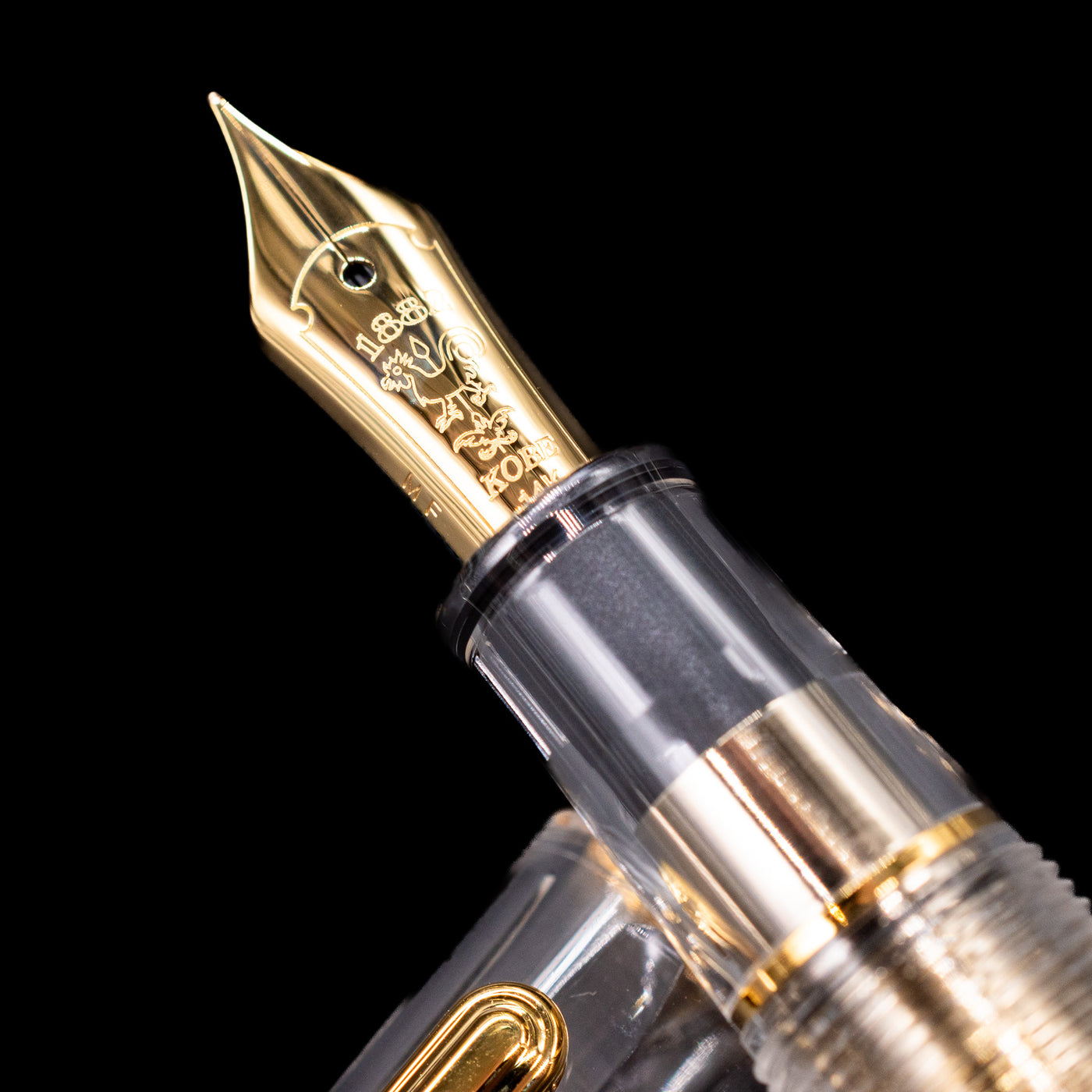 A macro shot of the nib with its intricate detailing and logo engraving for the Nagasawa Original Standard Fountain Pen - Skeleton Proske Gold.