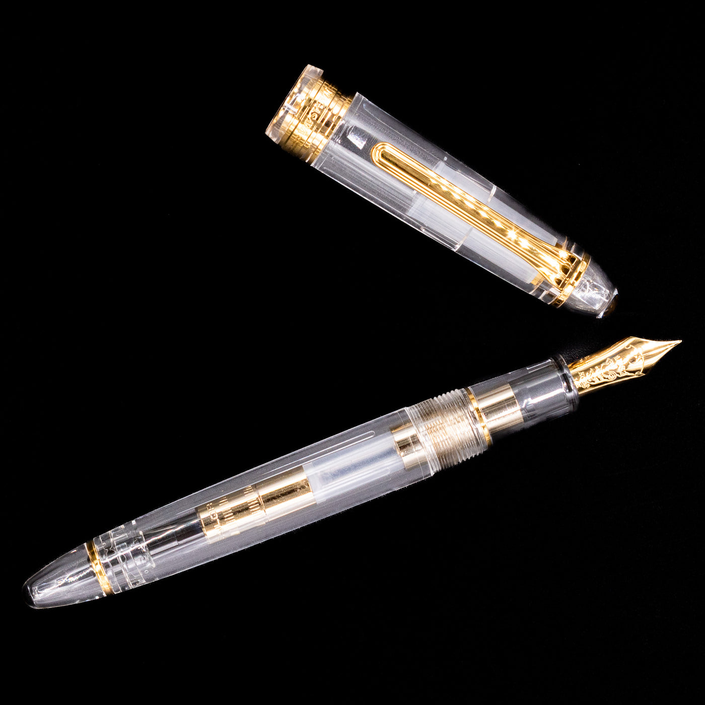 An overhead view of the Nagasawa Original Standard Fountain Pen - Skeleton Proske Gold uncapped.