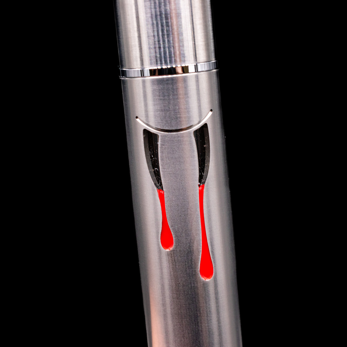 Close-up view of the window with teeth and blood on the body of the Nahvalur Dracula Fountain Pen.