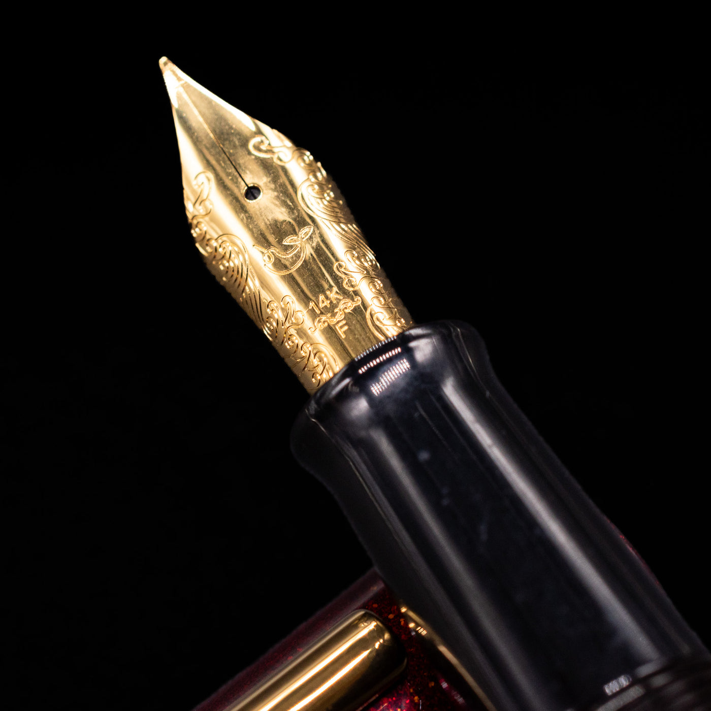 A macro shot of the nib with its intricate detailing and logo engraving for the Nahvalur Ikkaku Urushi Fountain Pen - Blood Moon.