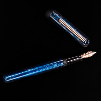 An overhead view of the Nahvalur Ikkaku Urushi Fountain Pen - Blue Moon uncapped.