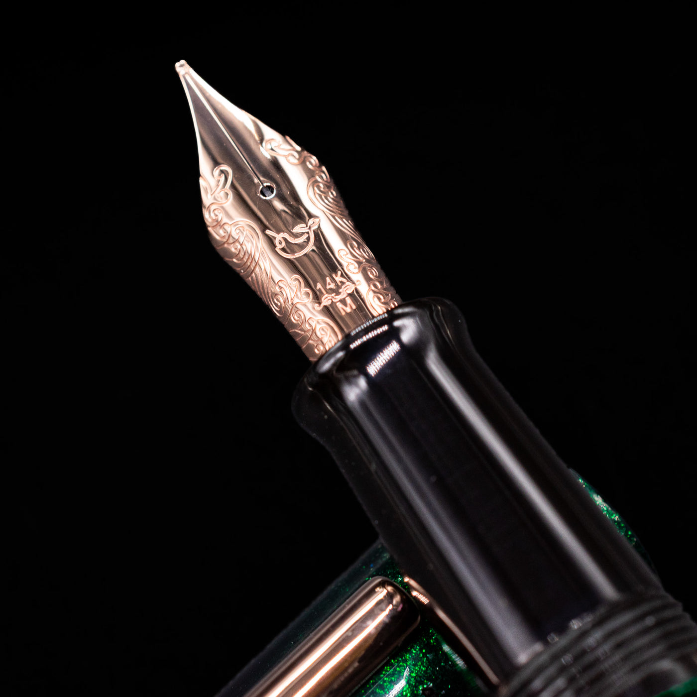 A macro shot of the nib with its intricate detailing and logo engraving for the Nahvalur Ikkaku Urushi Fountain Pen - Green Moon.