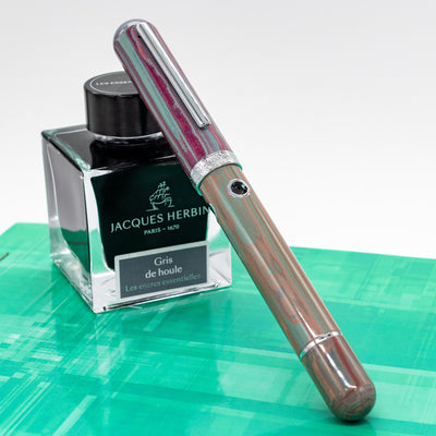 Nahvalur Nautilus Rhapsody fountain pen with chrome trim shown beside Jacques Herbin ink bottle – premium resin fountain pen for fine writing