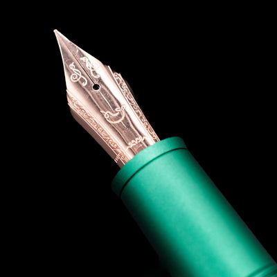  A macro shot of the nib with its intricate detailing and logo engraving for the Nahvalur Nautilus Limited Edition Fountain Pen Day 2025 - Emerald.