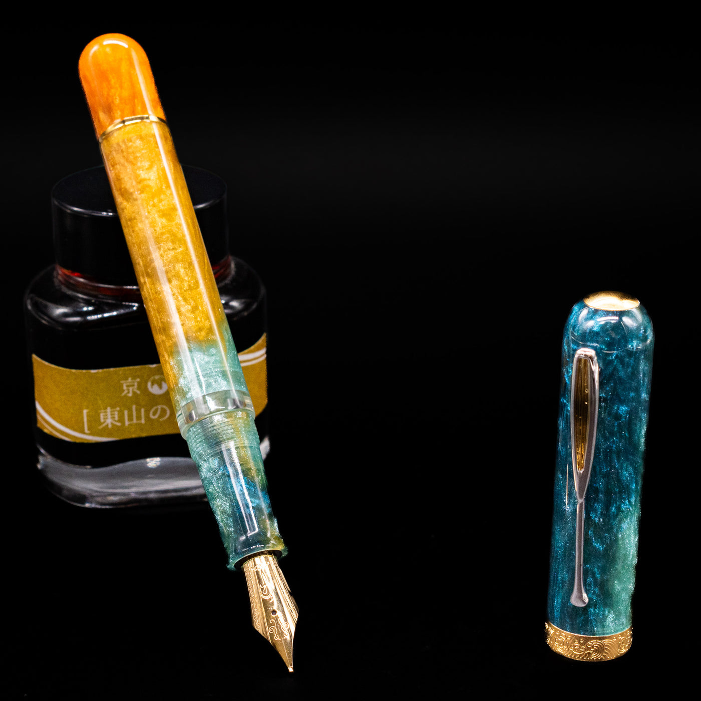 Nahvalur Voyage Fountain Pen - Hawaii leaning on an ink bottle uncapped showcasing the detailing on the nib.