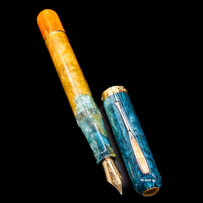 A full view of the Nahvalur Voyage Fountain Pen - Hawaii uncapped, with its cap laying next to the pen. 